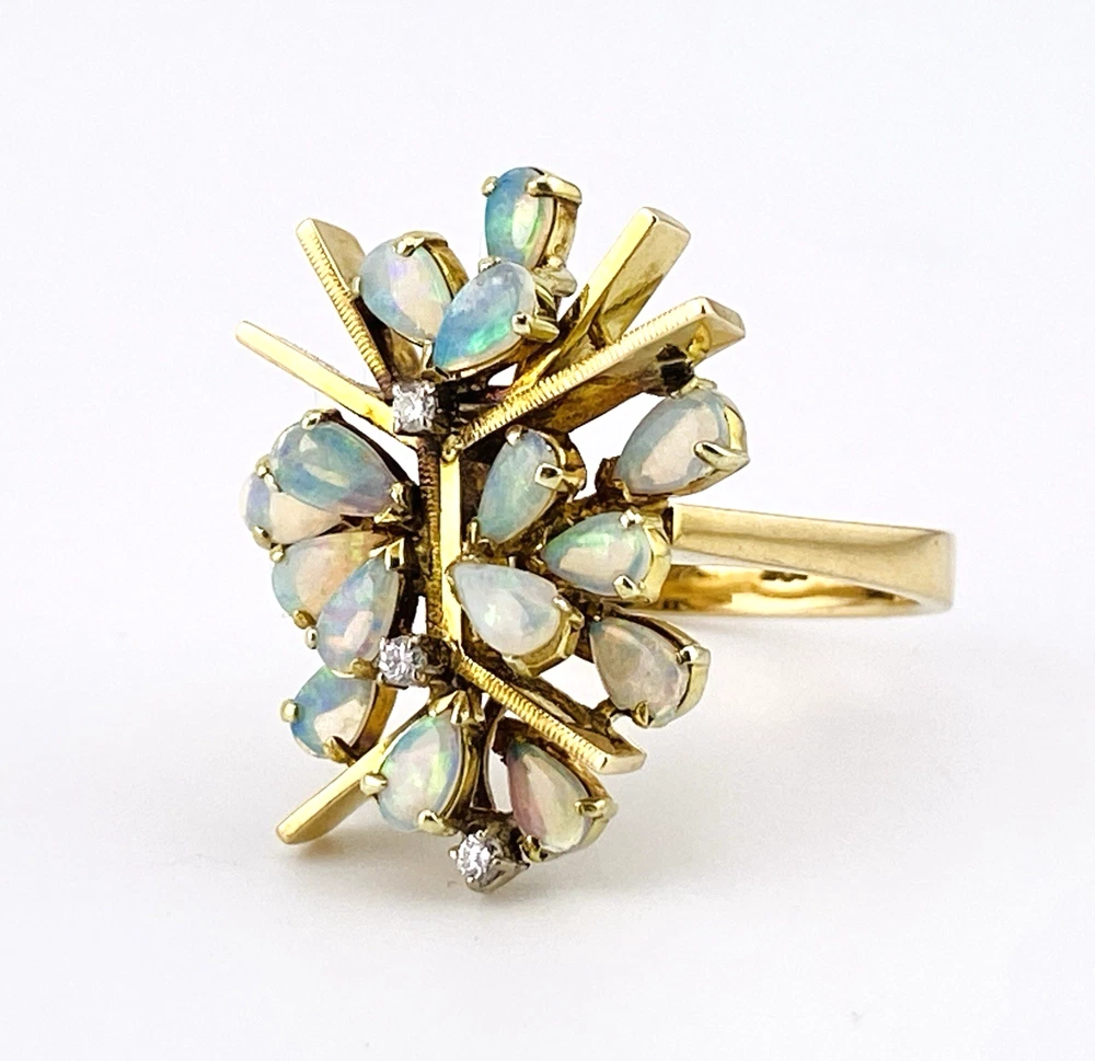 Circa 1960s hand-fabricated 14k gold Atomic starburst ring with natural pear-shaped opals and diamond accents