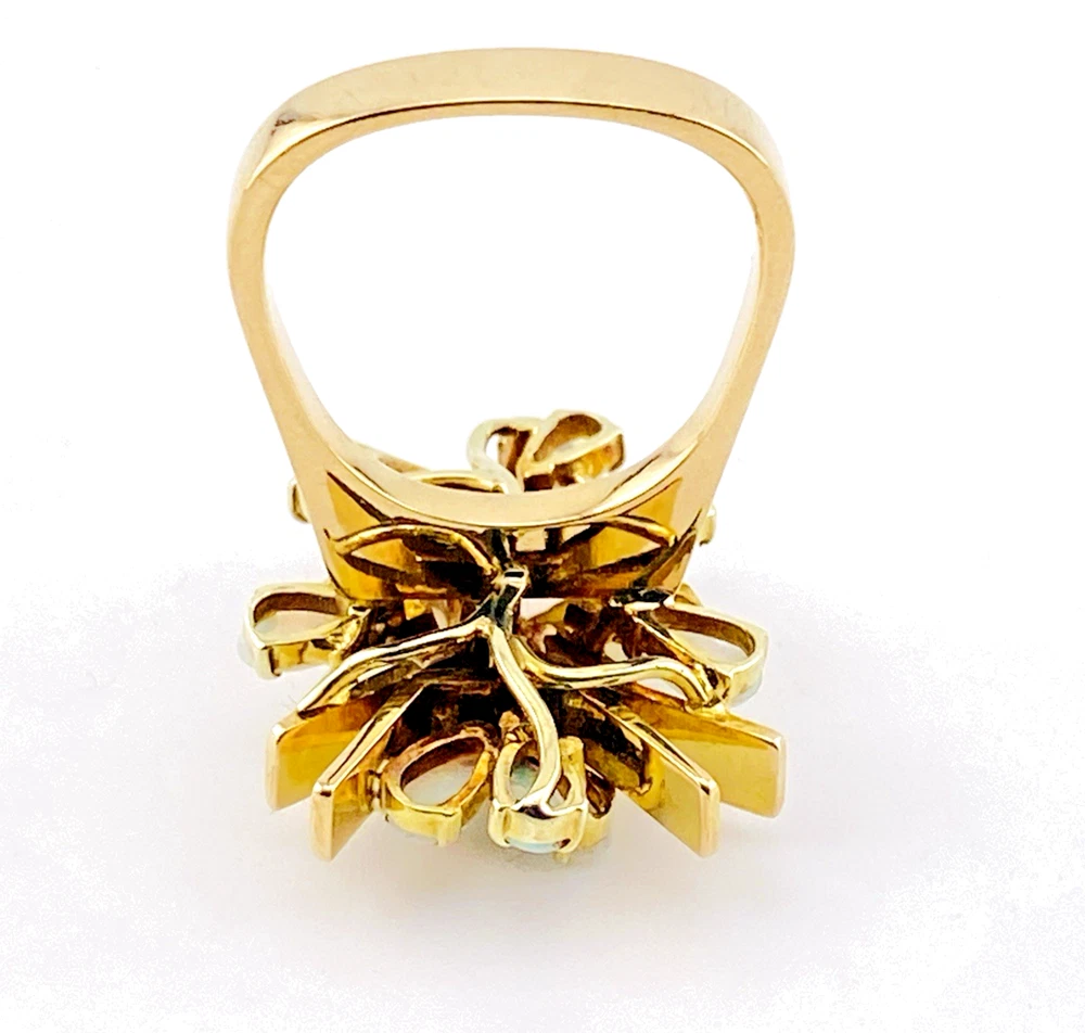 Circa 1960s hand-fabricated 14k gold Atomic starburst ring with natural pear-shaped opals and diamond accents