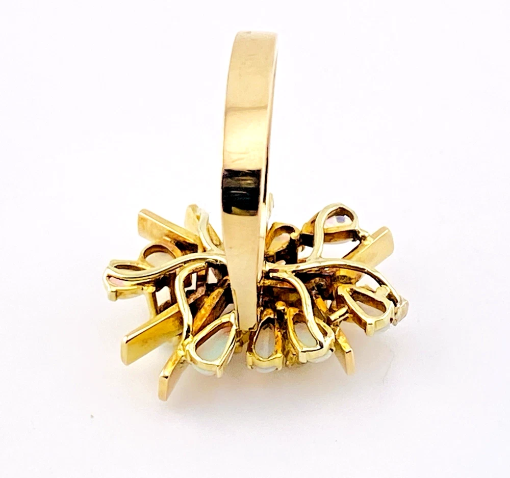 Circa 1960s hand-fabricated 14k gold Atomic starburst ring with natural pear-shaped opals and diamond accents
