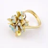 Circa 1960s hand-fabricated 14k gold Atomic starburst ring with natural pear-shaped opals and diamond accents