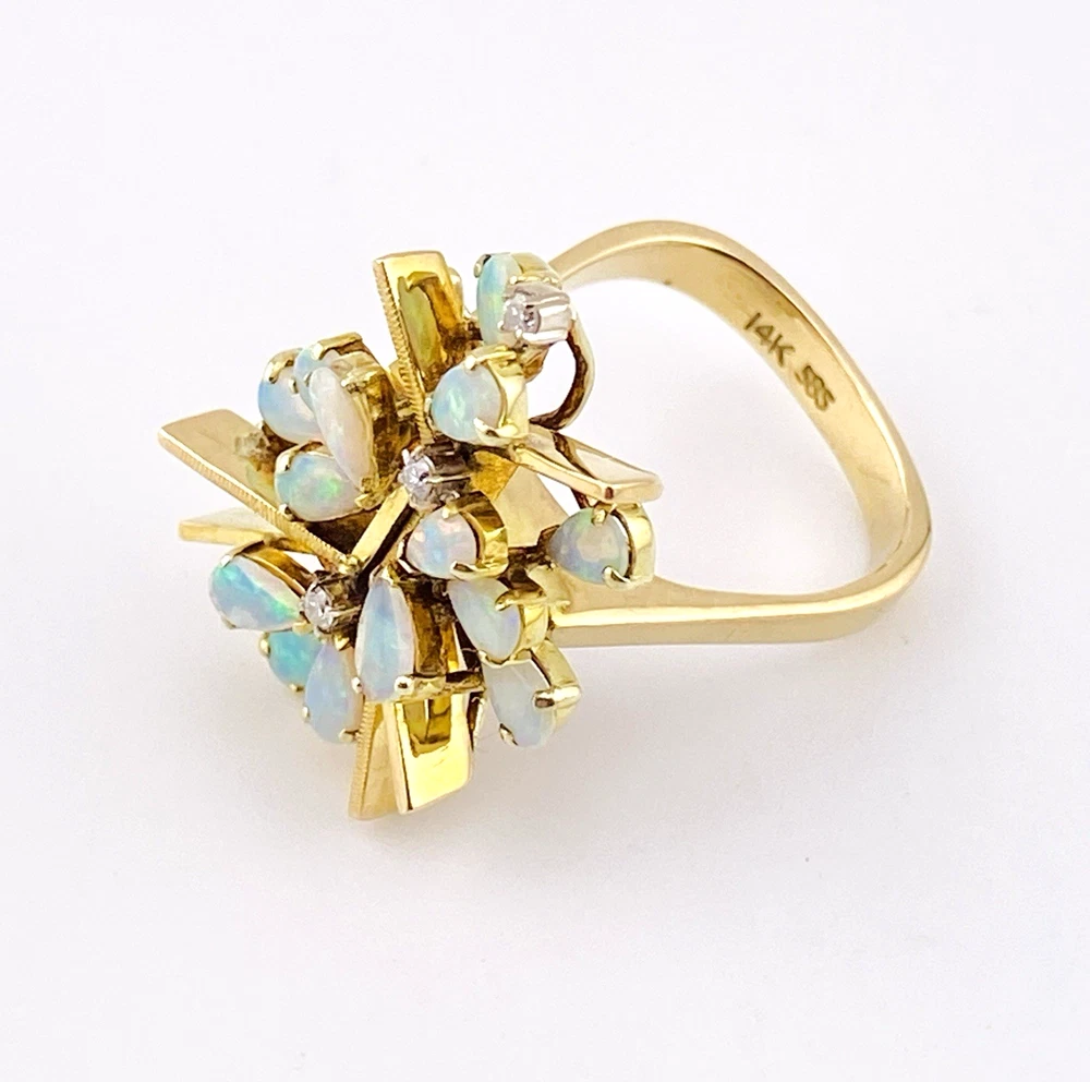 Circa 1960s hand-fabricated 14k gold Atomic starburst ring with natural pear-shaped opals and diamond accents