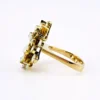 Circa 1960s hand-fabricated 14k gold Atomic starburst ring with natural pear-shaped opals and diamond accents