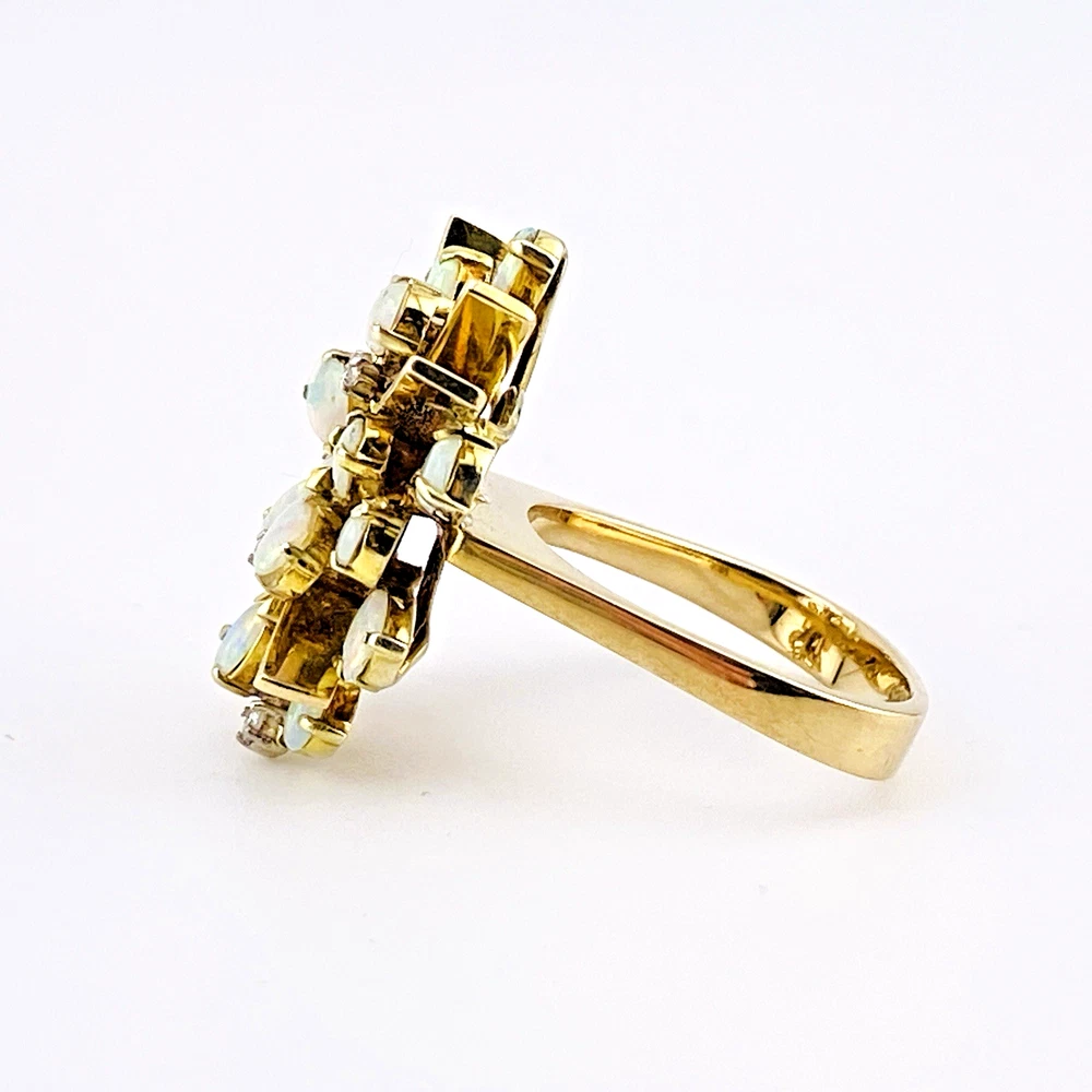 Circa 1960s hand-fabricated 14k gold Atomic starburst ring with natural pear-shaped opals and diamond accents