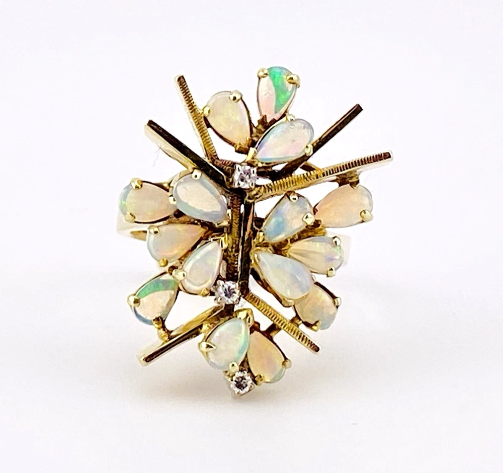 Circa 1960s hand-fabricated 14k gold Atomic starburst ring with natural pear-shaped opals and diamond accents