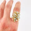 Circa 1960s hand-fabricated 14k gold Atomic starburst ring with natural pear-shaped opals and diamond accents