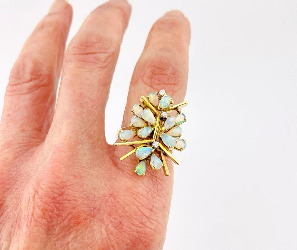 Circa 1960s hand-fabricated 14k gold Atomic starburst ring with natural pear-shaped opals and diamond accents