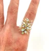 Circa 1960s hand-fabricated 14k gold Atomic starburst ring with natural pear-shaped opals and diamond accents
