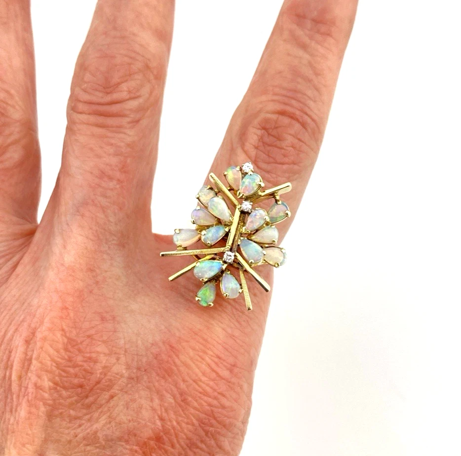 Circa 1960s hand-fabricated 14k gold Atomic starburst ring with natural pear-shaped opals and diamond accents