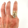 Circa 1960s hand-fabricated 14k gold Atomic starburst ring with natural pear-shaped opals and diamond accents