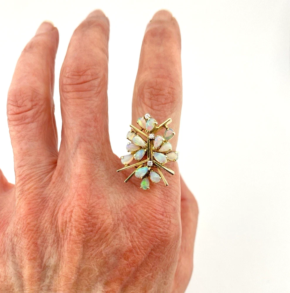 Circa 1960s hand-fabricated 14k gold Atomic starburst ring with natural pear-shaped opals and diamond accents