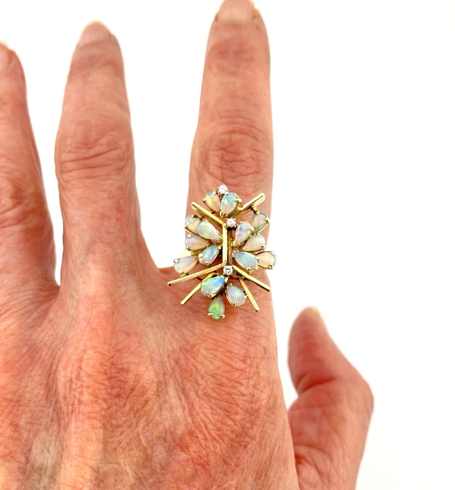 Circa 1960s hand-fabricated 14k gold Atomic starburst ring with natural pear-shaped opals and diamond accents