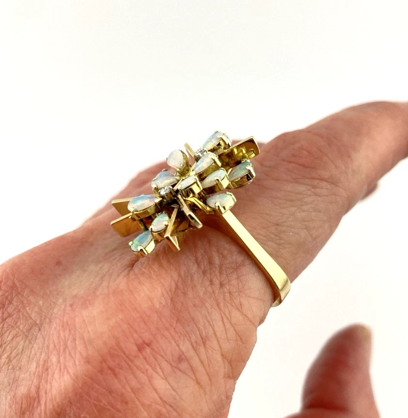 Circa 1960s hand-fabricated 14k gold Atomic starburst ring with natural pear-shaped opals and diamond accents