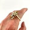 Circa 1960s hand-fabricated 14k gold Atomic starburst ring with natural pear-shaped opals and diamond accents