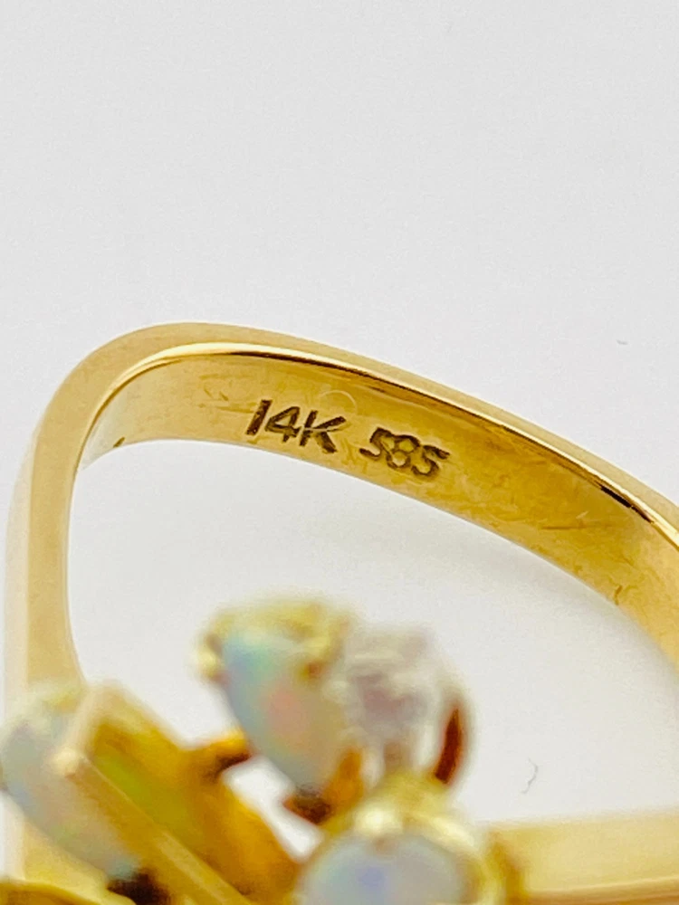 Circa 1960s hand-fabricated 14k gold Atomic starburst ring with natural pear-shaped opals and diamond accents