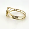 Circa 1950s gold-filled openwork clamper bracelet with rectangular amethyst glass stone and scroll decoration