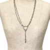 Long 800 silver guard chain with ribbon-bound sheaf links, swivel dog clip, and spring ring, shown doubled on a mannequin