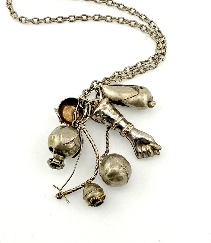 Vintage Brazilian silver-tone Penca de Balangandãs necklace with six dimensional charms and protective figa hand