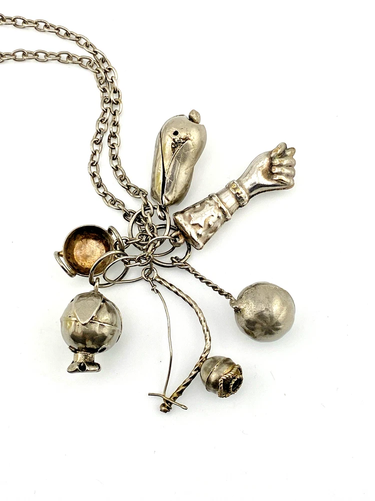 Vintage Brazilian silver-tone Penca de Balangandãs necklace with six dimensional charms and protective figa hand