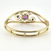 Circa 1950s gold-filled openwork clamper bracelet with rectangular amethyst glass stone and scroll decoration