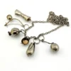 Vintage Brazilian silver-tone Penca de Balangandãs necklace with six dimensional charms and protective figa hand