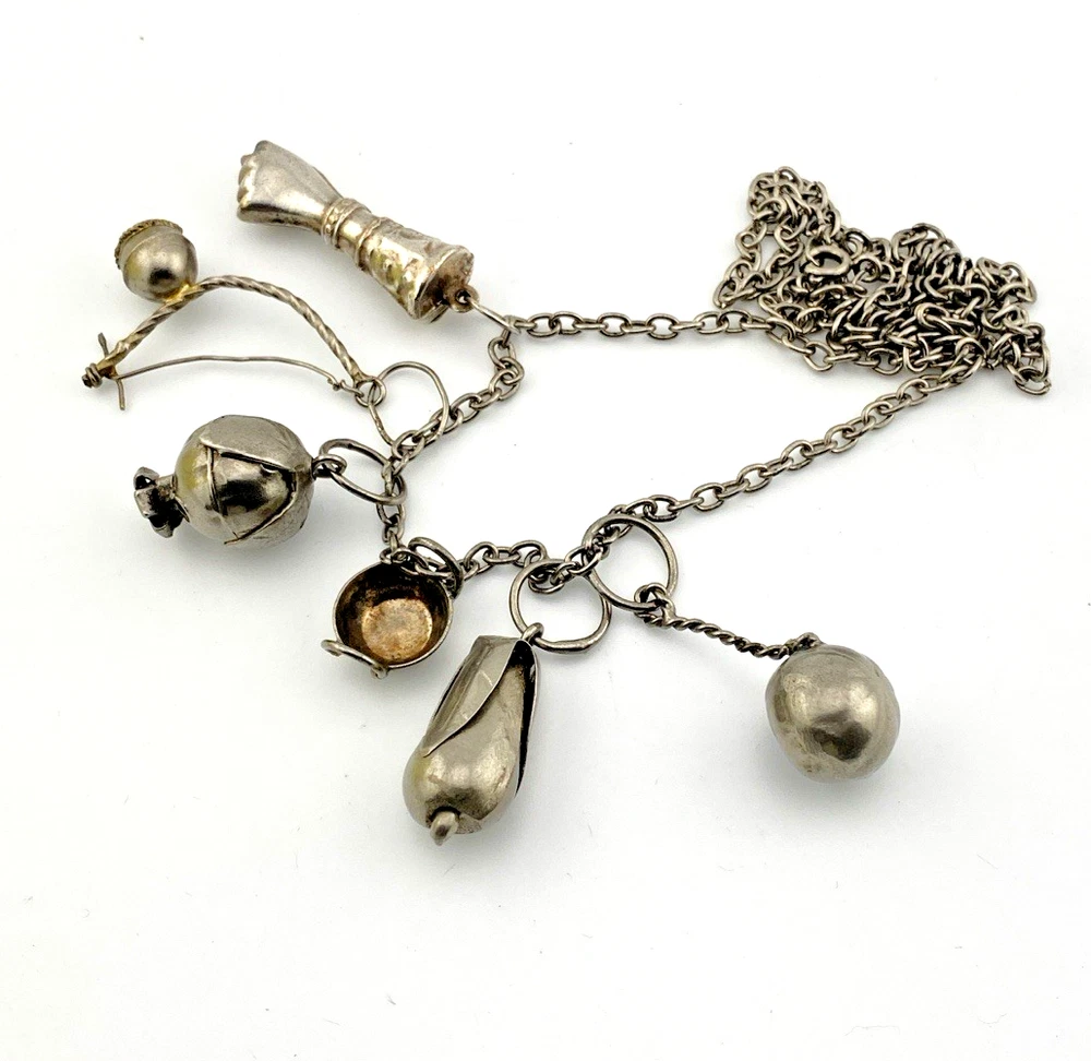 Vintage Brazilian silver-tone Penca de Balangandãs necklace with six dimensional charms and protective figa hand