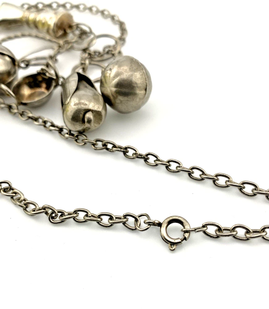 Vintage Brazilian silver-tone Penca de Balangandãs necklace with six dimensional charms and protective figa hand