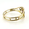 Circa 1950s gold-filled openwork clamper bracelet with rectangular amethyst glass stone and scroll decoration