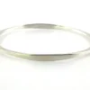 Sculptural Mexican silver bangle narrowing from 5mm to 2mm along the sides