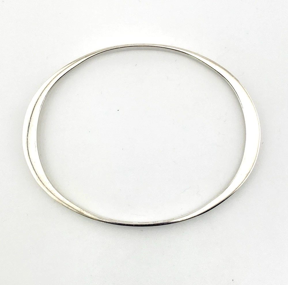 Oval interior of Taxco sterling silver bangle with a 7 3/4-inch circumference