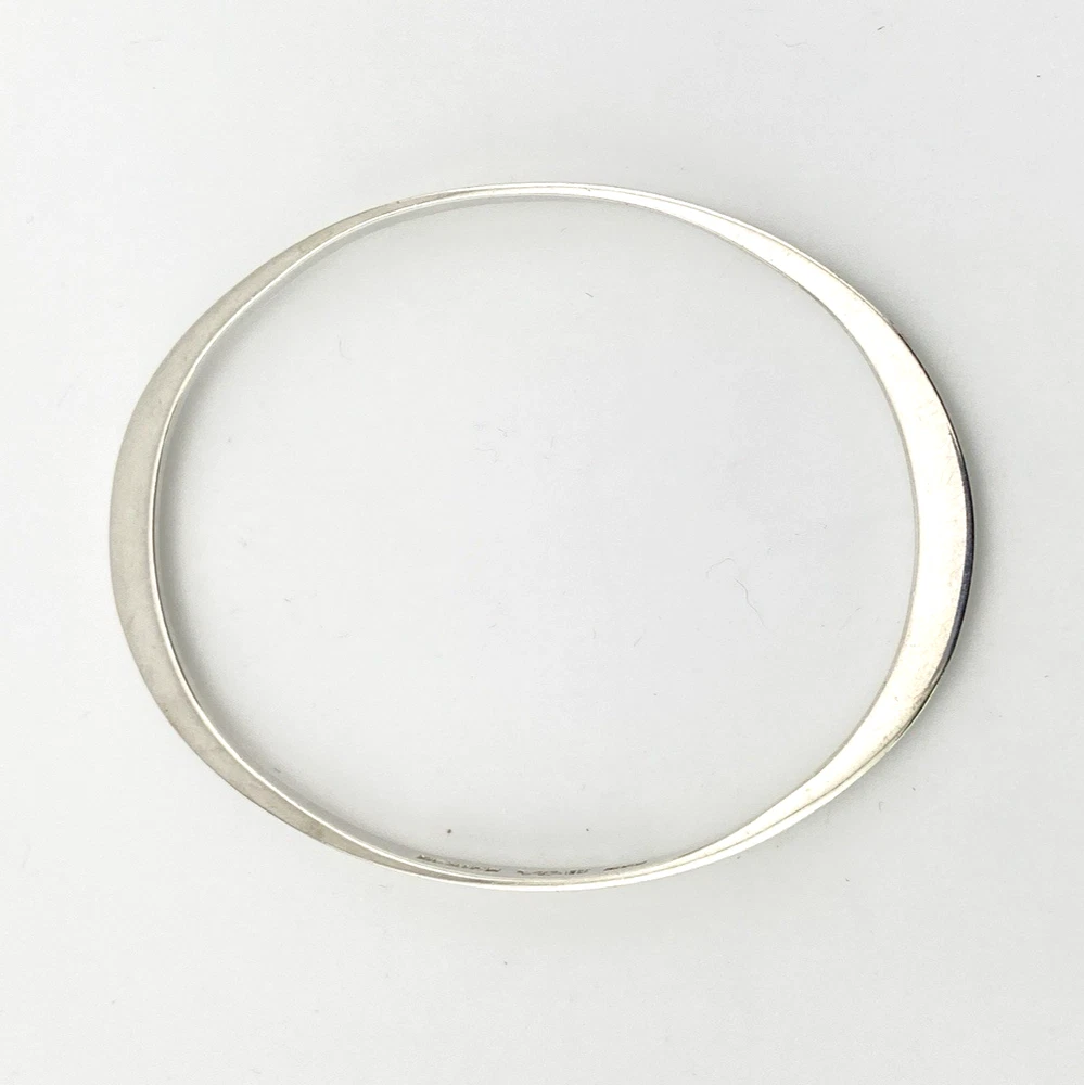 Oval interior of Taxco sterling silver bangle with a 7 3/4-inch circumference