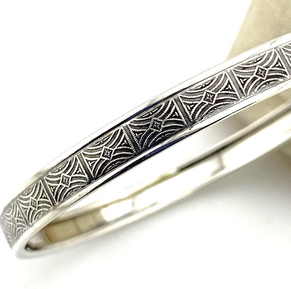 Vintage Beau sterling silver wide bangle with mirrored arch and diamond geometric pattern