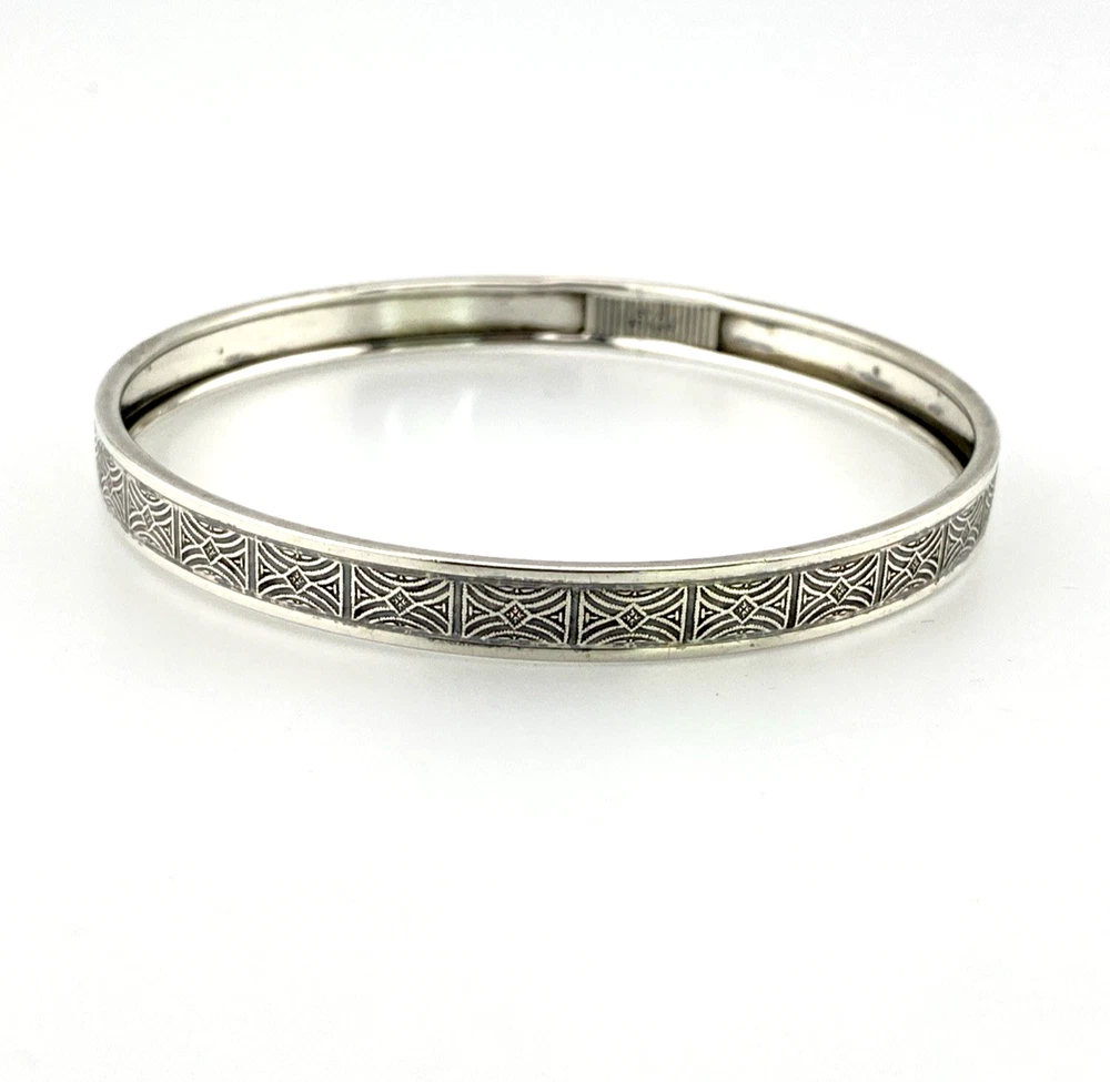 Round mid-century Beau Sterling bangle bracelet with a 7 3/4-inch interior circumference