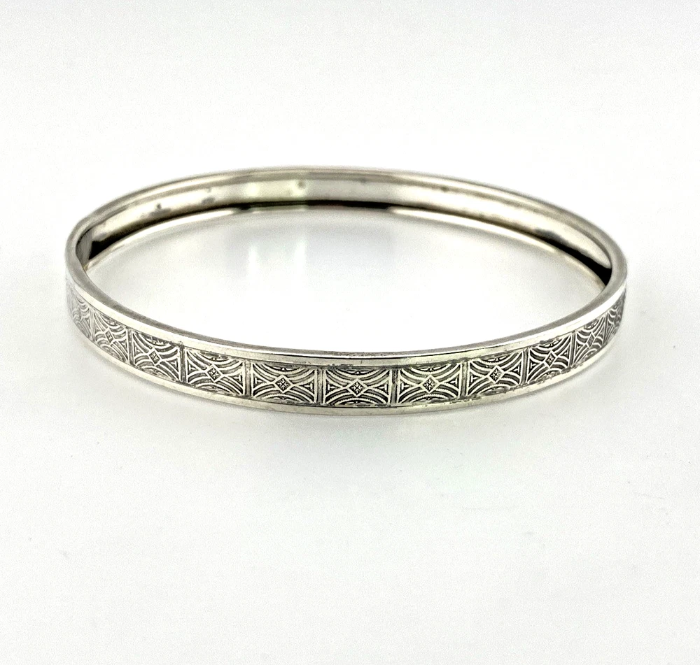 Round mid-century Beau Sterling bangle bracelet with a 7 3/4-inch interior circumference