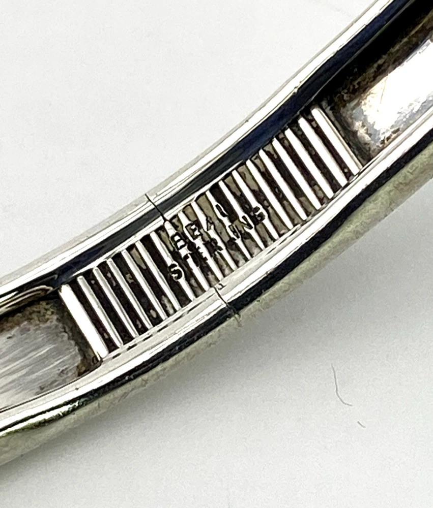 Two-line Beau Sterling hallmark inside vintage silver bangle bracelet