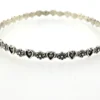 Mid-century Beau Sterling hearts-and-flowers bangle with an 8-inch circumference