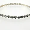 Mid-century Beau Sterling hearts-and-flowers bangle with an 8-inch circumference