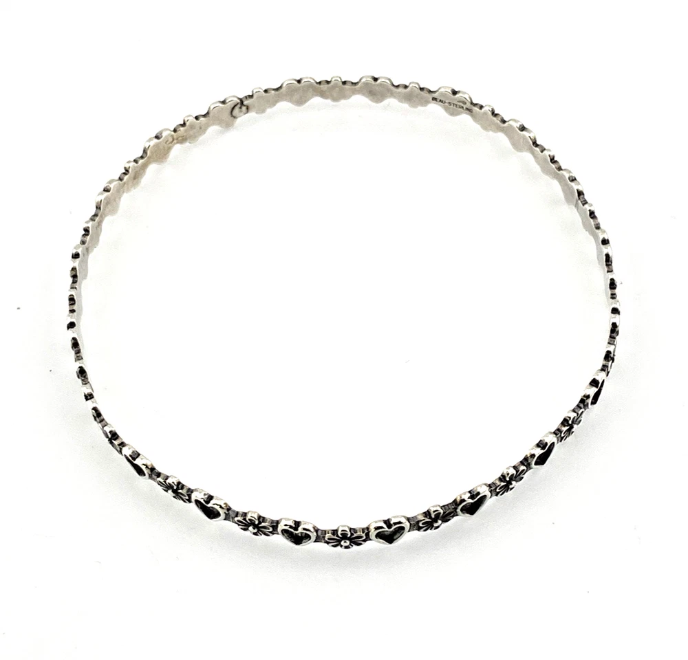Mid-century Beau Sterling hearts-and-flowers bangle with an 8-inch circumference