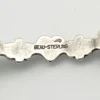 Beau-Sterling hallmark inside vintage silver bangle bracelet