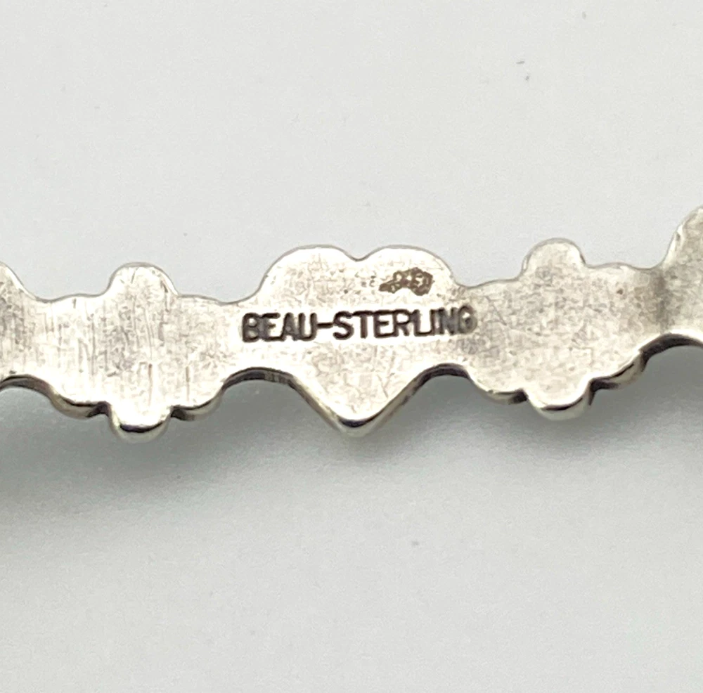 Beau-Sterling hallmark inside vintage silver bangle bracelet