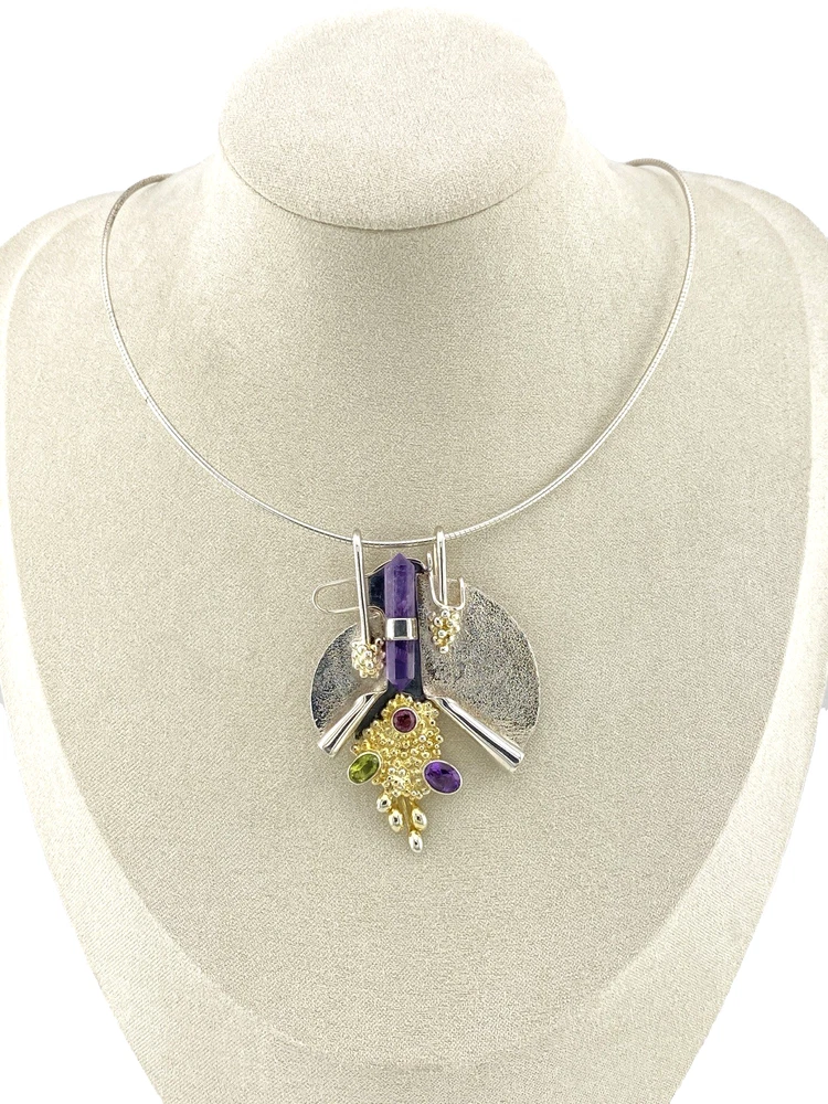 Sculptural Modernist gemstone pendant displayed on its 19-inch flexible cable necklace