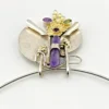 Showing sculptural depth on late 1980s Modernist sterling silver and gold-vermeil Art-to-Wear pendant necklace with amethyst, garnet and peridot view from above