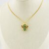 Gold-plated sterling silver bee brooch with a green gemstone-set body, clear cubic zirconia accent, raised patterned wings, and textured legs.