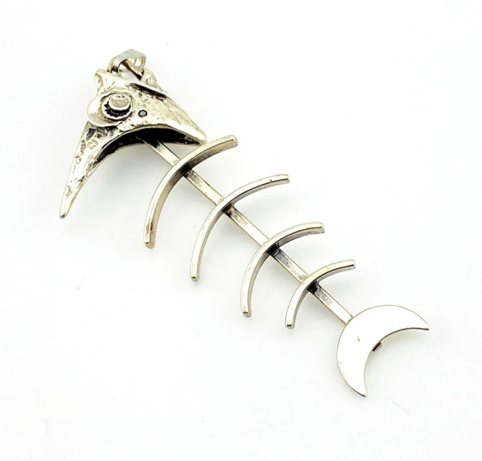 Vintage sterling silver fish skeleton pendant with cast head and articulated fabricated body