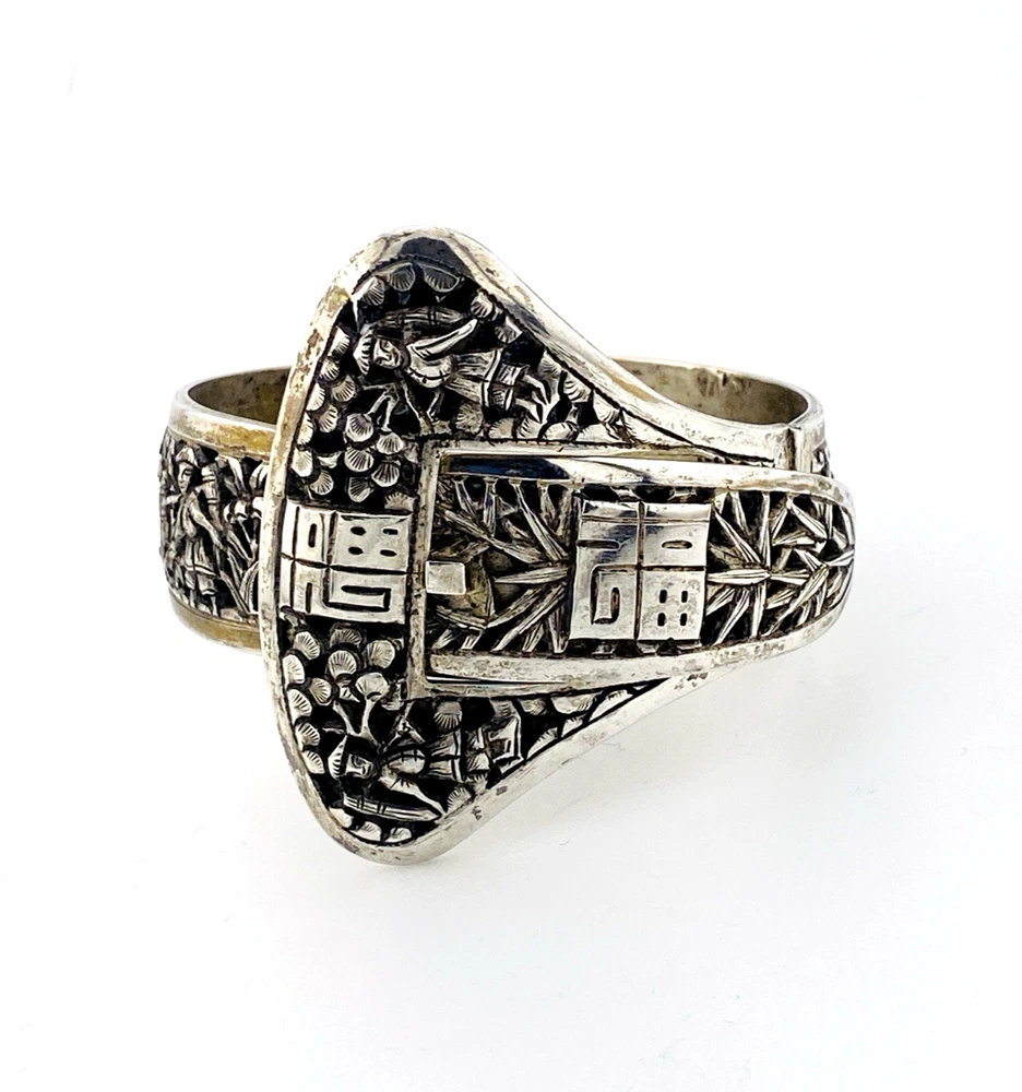 Chinese export silver buckle bracelet with pierced bamboo, flowers, figures and raised Chinese characters