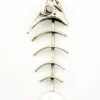 Vintage sterling silver fish skeleton pendant with cast head and articulated fabricated body