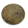 1909 Hudson-Fulton bronze medal showing Robert Fulton’s portrait above three seated allegorical women and a model steamboat.