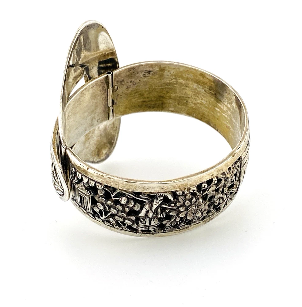 Chinese export silver buckle bracelet with pierced bamboo, flowers, figures and raised Chinese characters