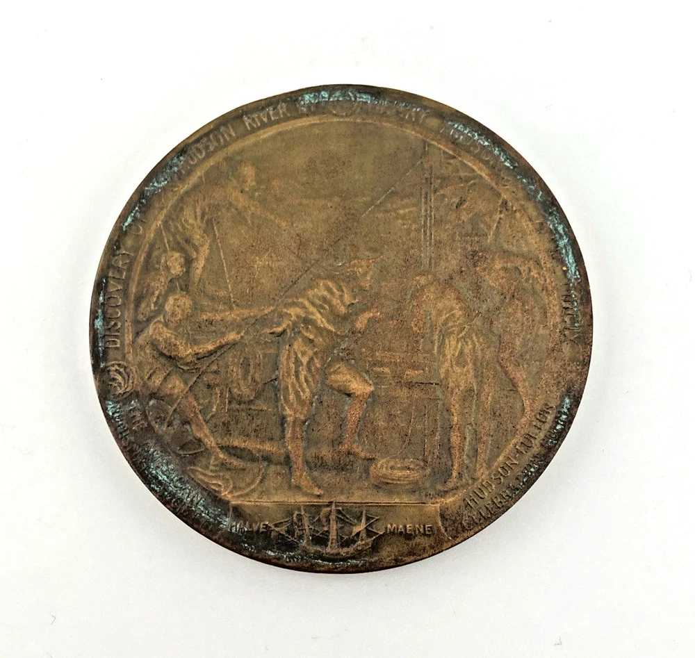 1909 Hudson-Fulton bronze medal showing Robert Fulton’s portrait above three seated allegorical women and a model steamboat.