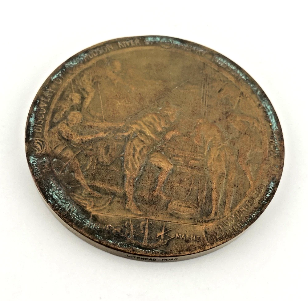 1909 Hudson-Fulton bronze medal showing Robert Fulton’s portrait above three seated allegorical women and a model steamboat.