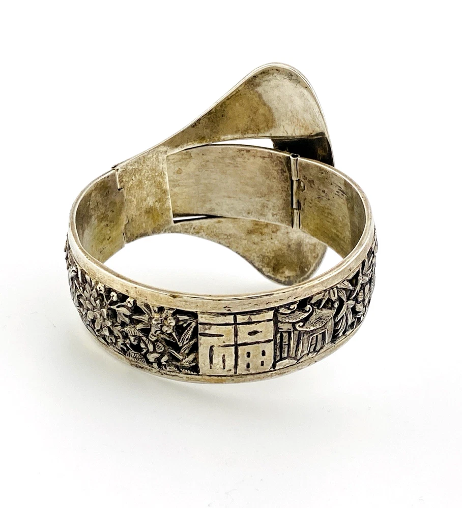 Chinese export silver buckle bracelet with pierced bamboo, flowers, figures and raised Chinese characters